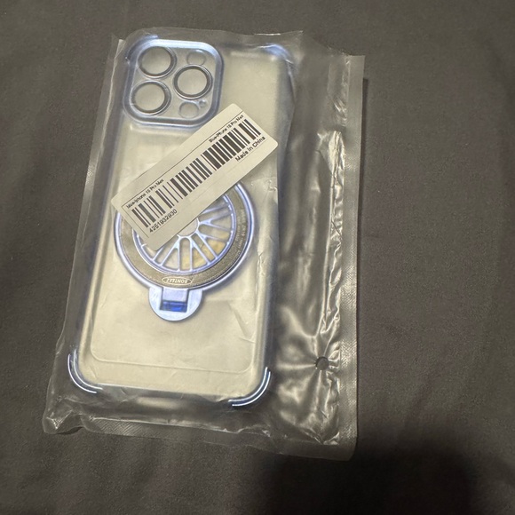Clear Phone Case with Blue Accents For a 15 Pro Max. Spinning wheel in Center. - Picture 14 of 14